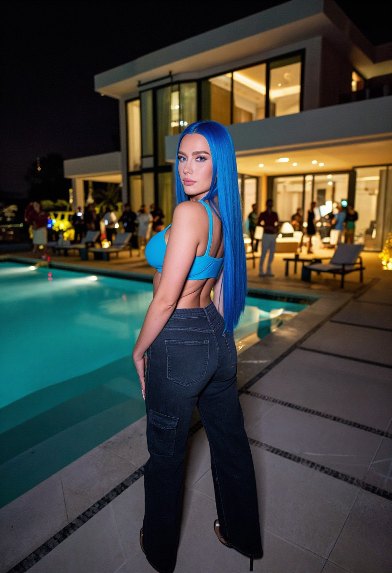 detailed texture, 8k, igmodel, hyper realistic, 
russian super model, saphire blue long straight hair, blue sports bra, dark wide jeans, at huge house party, next to vision swimming pool.