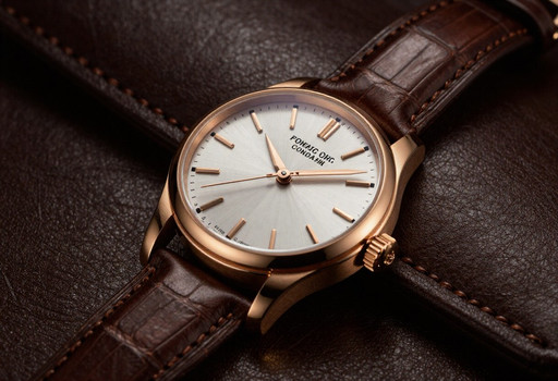Ultra-realistic luxury wristwatch product photo, rose gold case, white silver dial, brown alligator leather strap, resting on rich dark brown leather, warm studio lighting, shallow depth of field, macro photography, highly detailed watch face, polished metal reflections, premium Swiss watch advertisement, photorealistic, 8K, professional commercial photography.
